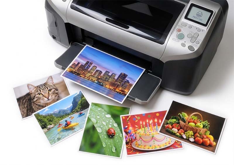 Printed photos on a white desk Printed photos on a white desk