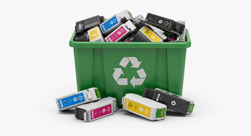 Recycling used ink cartridges in a bin Recycling used ink cartridges in a bin