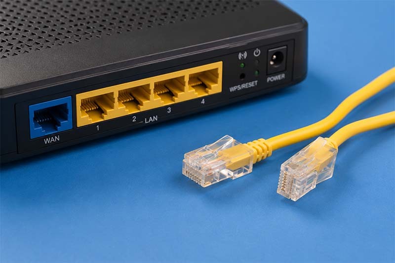 Router and Ethernet cable still life Router and Ethernet cable still life